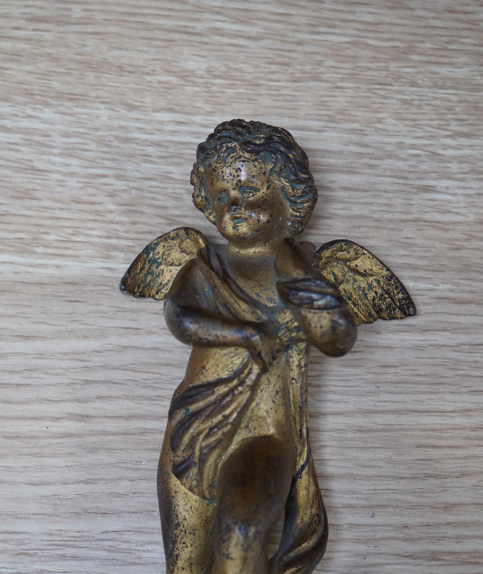 A 19th century ormolu ‘cherub’ mount, 16cm. Condition - worn